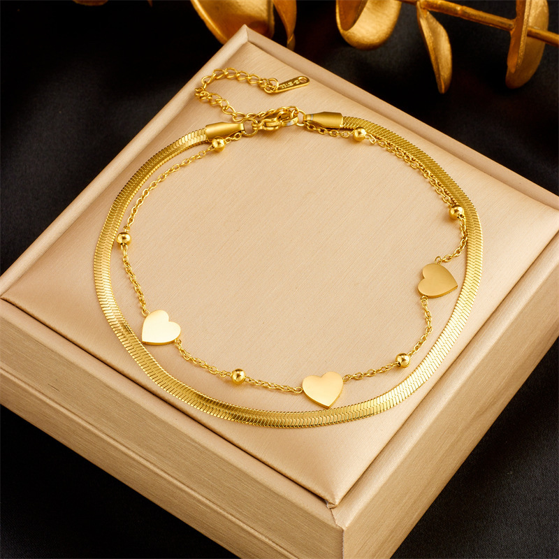 Unique design, heart-shaped chain, double-layered, gold-plated titanium steel, fashionable and versatile anklet.