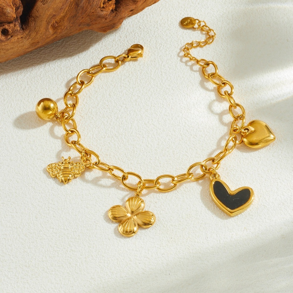 Korean style, fashionable and simple, gold-plated black dripping heart and flower pendant, stainless steel chain, versatile jewelry bracelet.