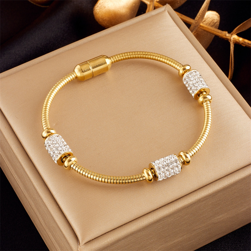 Stylish, sophisticated, niche design, understated luxury, versatile gold-plated butterfly, pearl, flower, and diamond-encrusted bracelet.