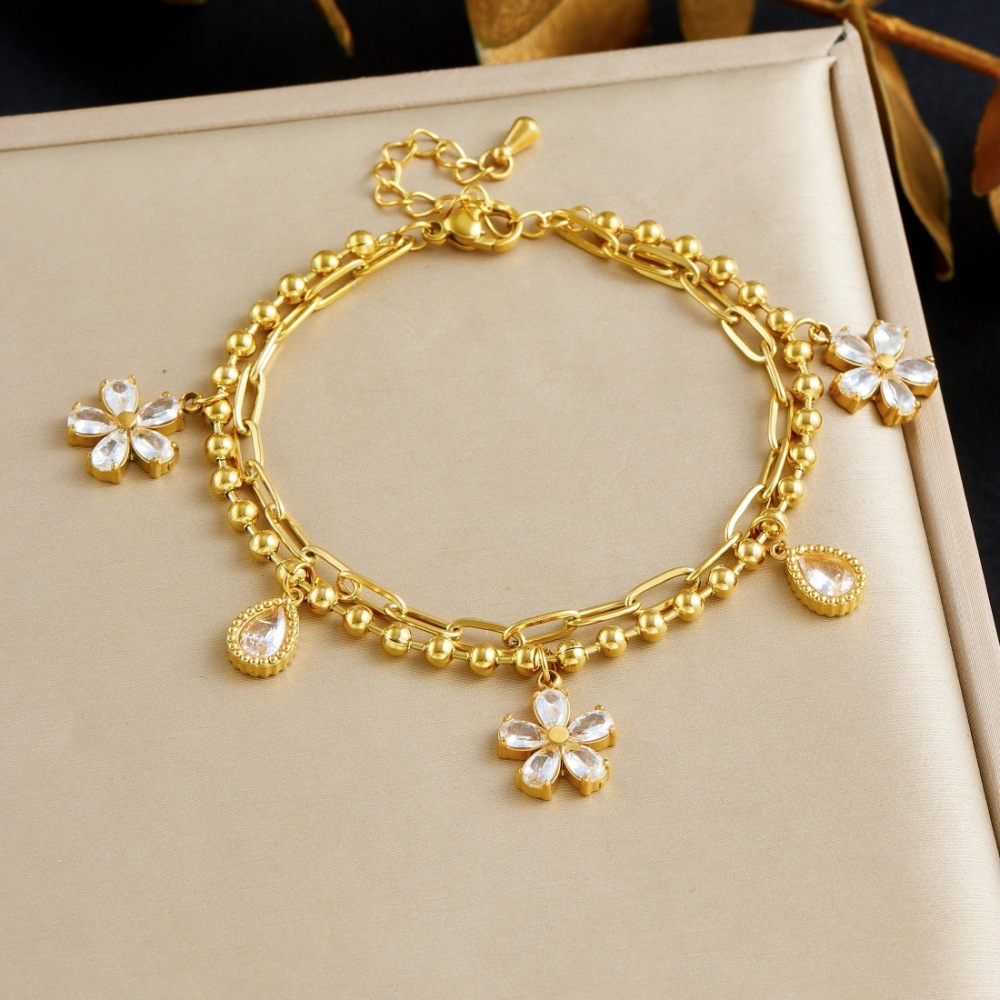 Trendy, niche, minimalist, cool-toned diamond-encrusted star, moon, and flower pendant, double-layered stainless steel gold-plated versatile bracelet.
