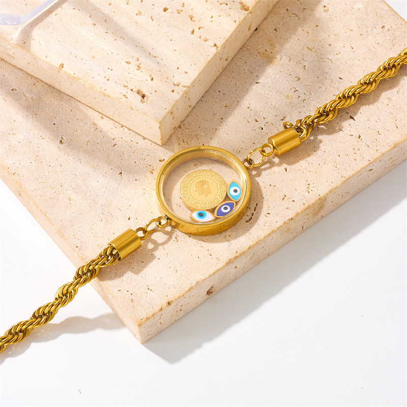 Fashionable retro creative personalized round pendant portrait eyes twisted chain gold-plated titanium steel bracelet
