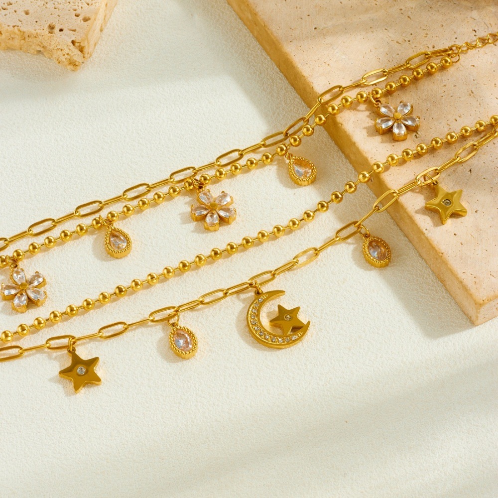 Trendy, niche, minimalist, cool-toned diamond-encrusted star, moon, and flower pendant, double-layered stainless steel gold-plated versatile bracelet.