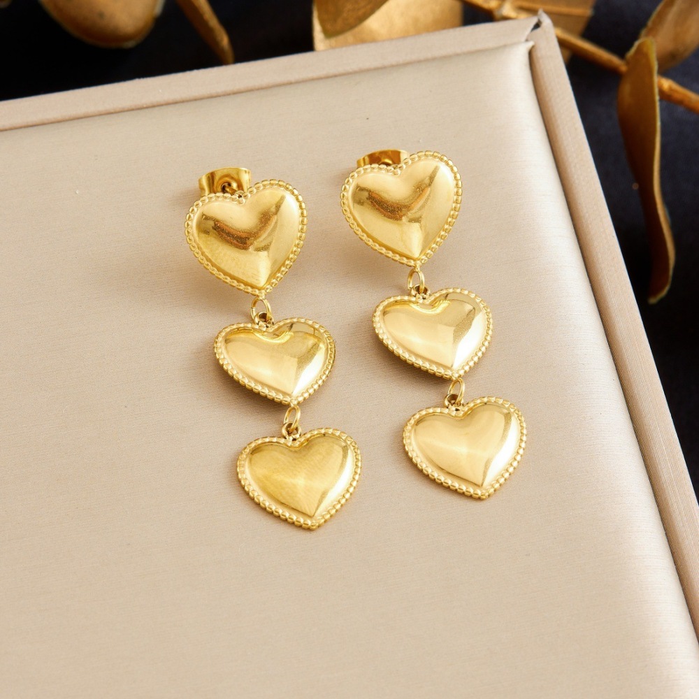 Korean style minimalist fashion, glossy gold-plated heart-shaped long dangling earrings, stainless steel jewelry.