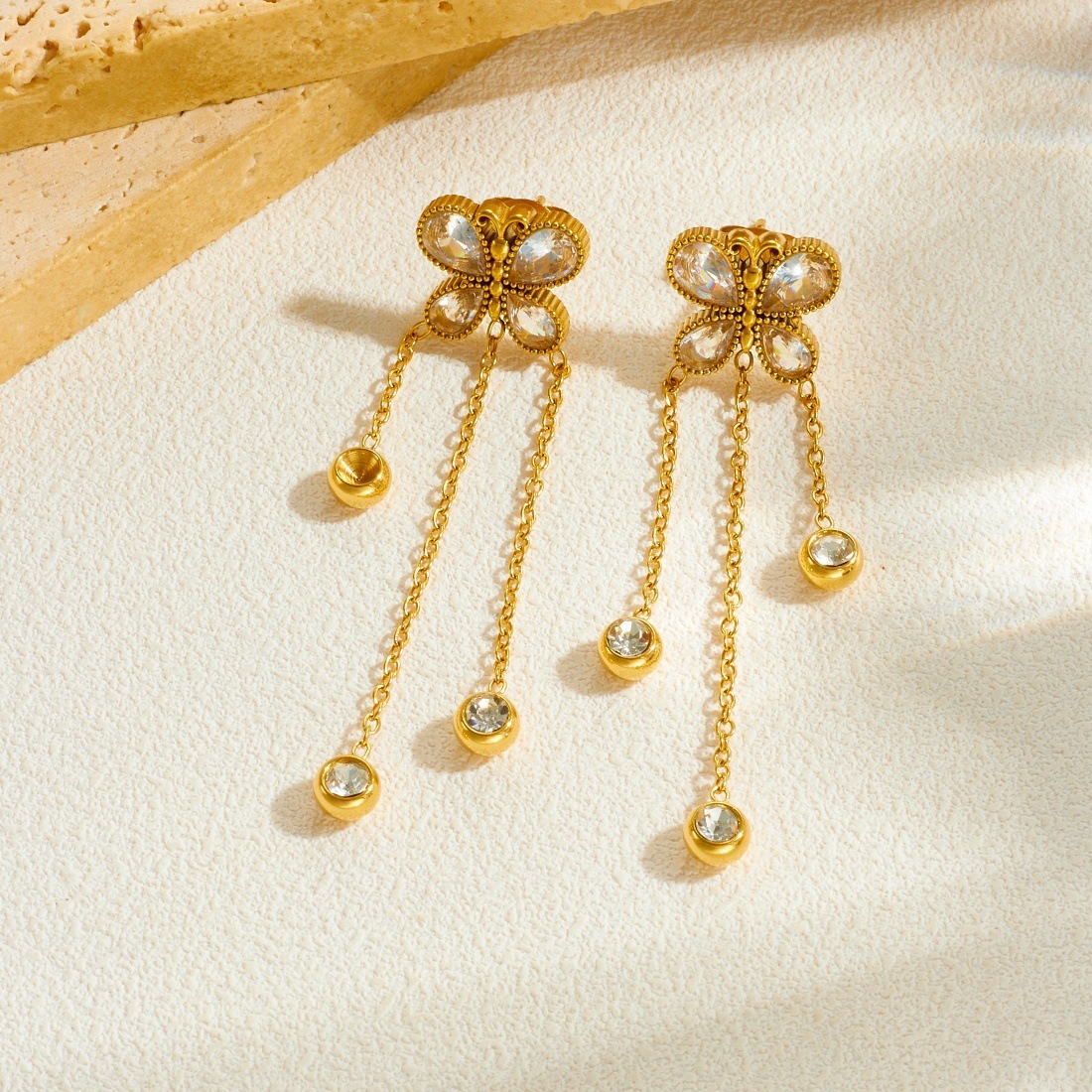 Stylish and simple everyday wear long dangling tassel chain round pendant butterfly gold-plated earrings