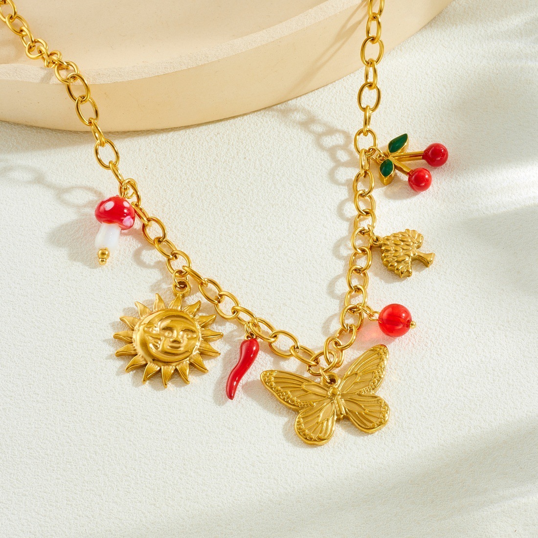 Cross-border fashion gold-plated multi-element pendant sun bow dripping cherry pendant stainless steel jewelry necklace