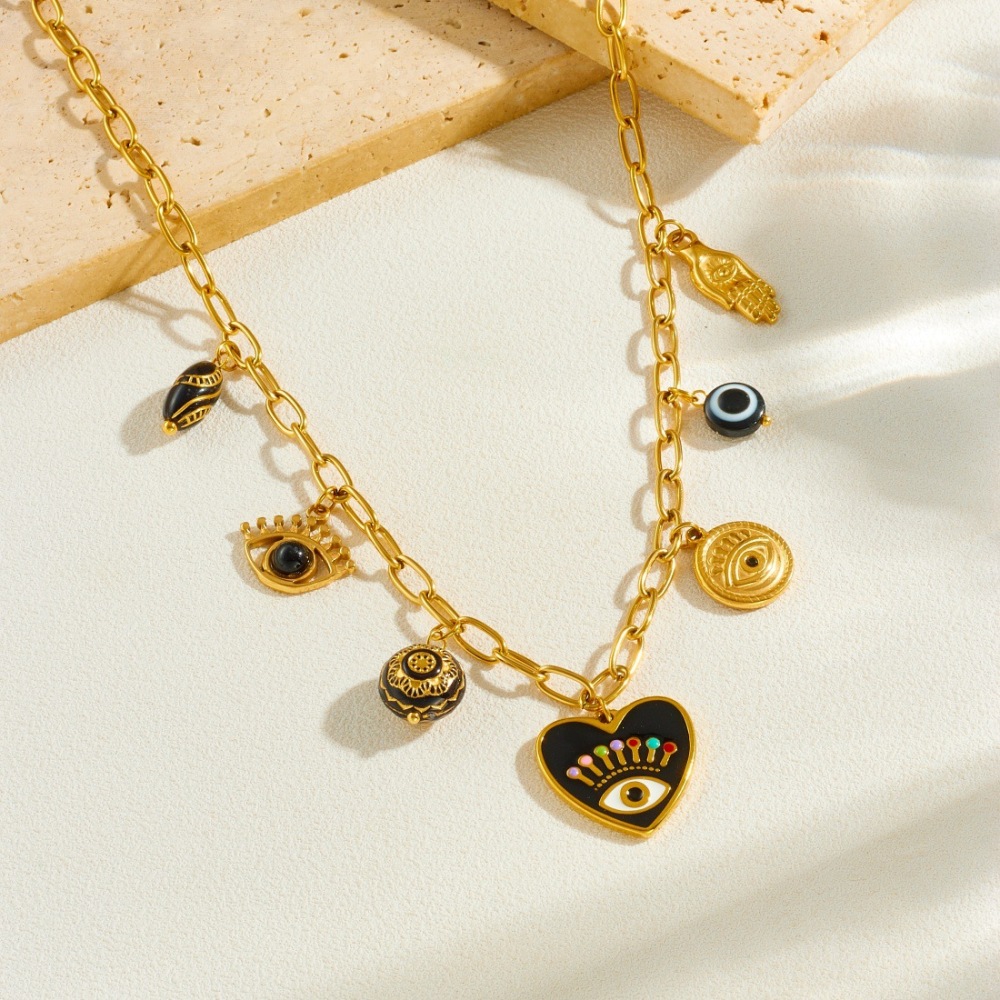Cross-border fashion dripping dark style heart-shaped eye pendant round black gold carved palm pendant jewelry set
