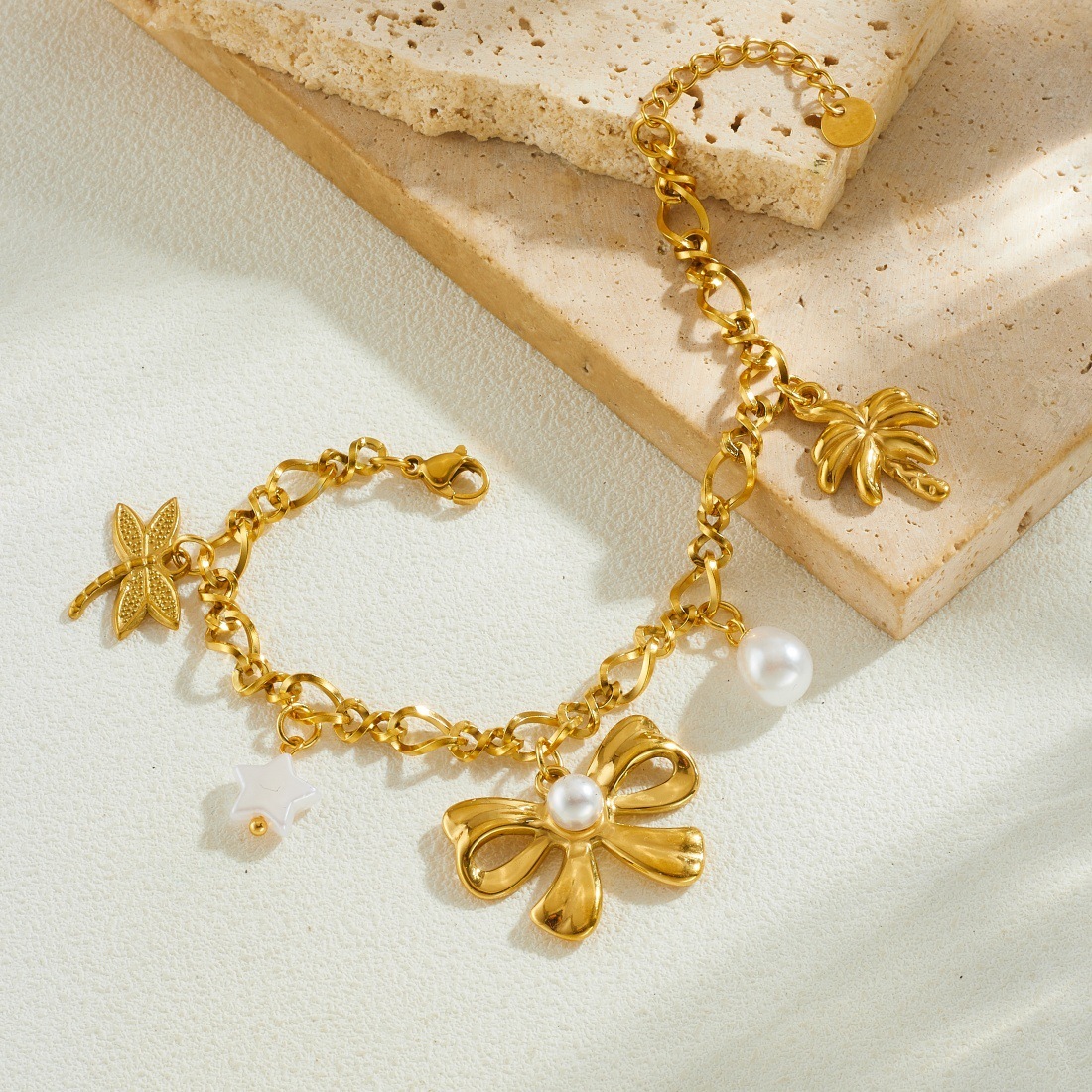 Korean style, fashionable and simple gold-plated pearl bow pendant chain, stainless steel coconut tree dragonfly pendant bracelet for women.