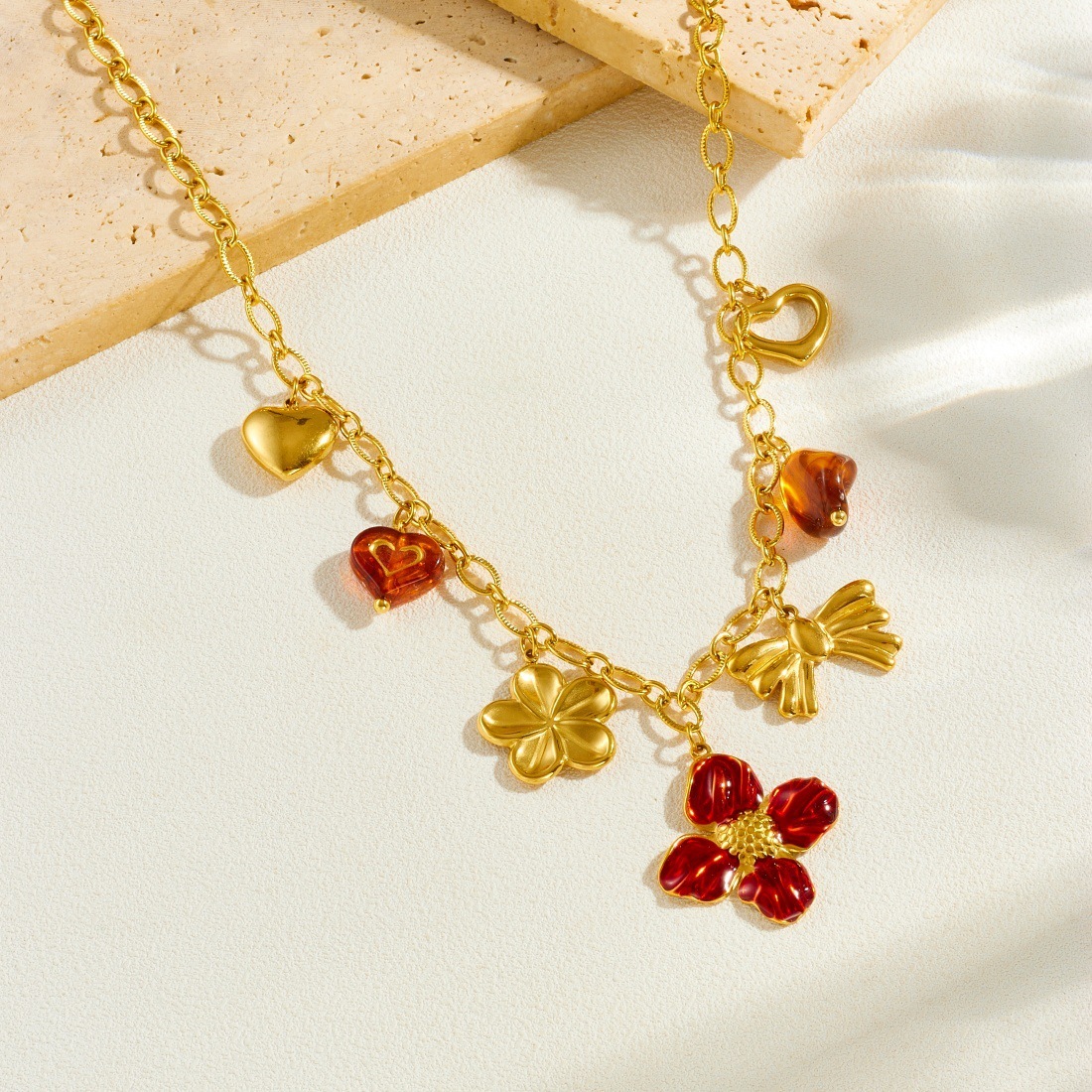 Cross-border fashion, light luxury, retro gold-plated drip flower bow heart pendant chain stainless steel jewelry necklace
