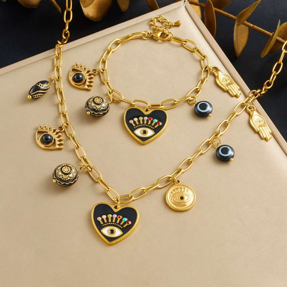 Cross-border fashion dripping dark style heart-shaped eye pendant round black gold carved palm pendant jewelry set