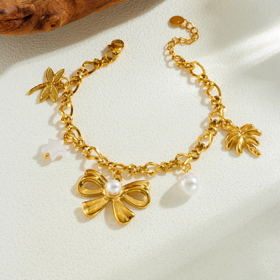 Korean style, fashionable and simple gold-plated pearl bow pendant chain, stainless steel coconut tree dragonfly pendant bracelet for women.