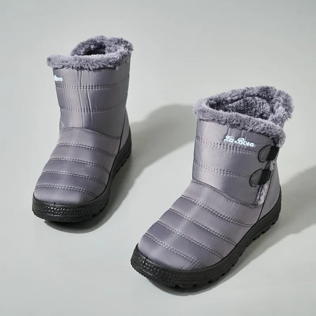 Snowy boots with splash resistant upper for warmth and thickened interior for outdoor use
