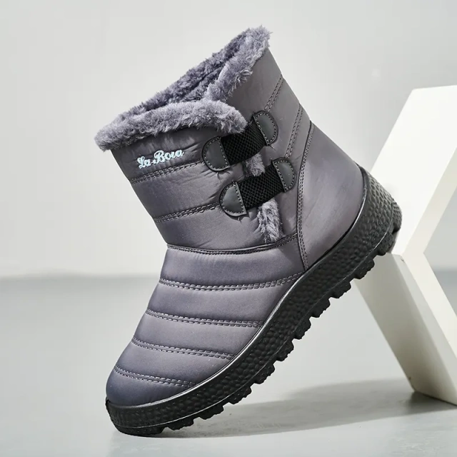 Snowy boots with splash resistant upper for warmth and thickened interior for outdoor use
