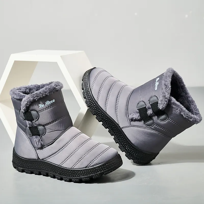 Snowy boots with splash resistant upper for warmth and thickened interior for outdoor use