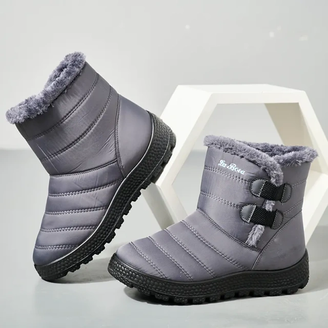 Snowy boots with splash resistant upper for warmth and thickened interior for outdoor use