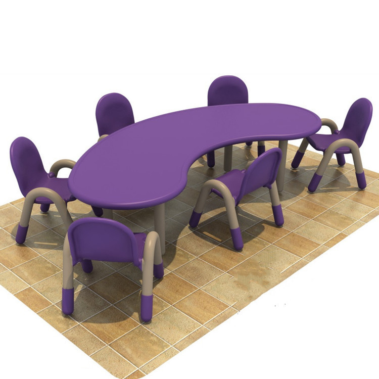Kindergarten children study writing drawing dining table