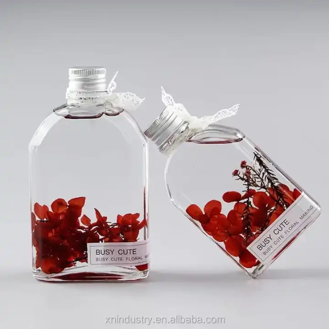 Amazing gifts real dried flowers floating herbarium oil bottle glass bottles for dried flowers decoration