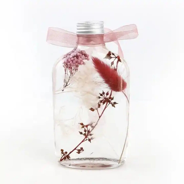 Amazing gifts real dried flowers floating herbarium oil bottle glass bottles for dried flowers decoration