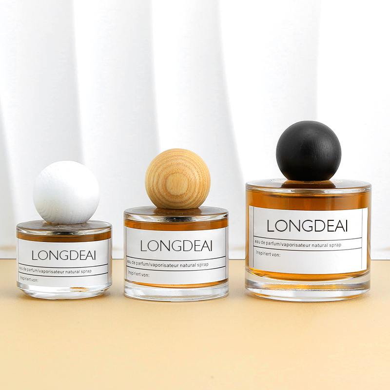 Wholesale round 30ml glass perfume bottle 50ml 100ml with wooden caps