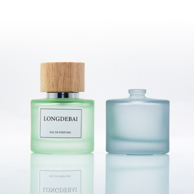 Wholesale empty frost green blue round 50ml glass perfume bottle with wooden lid