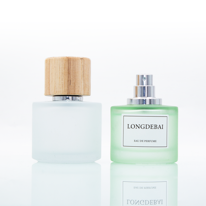 Wholesale empty frost green blue round 50ml glass perfume bottle with wooden lid