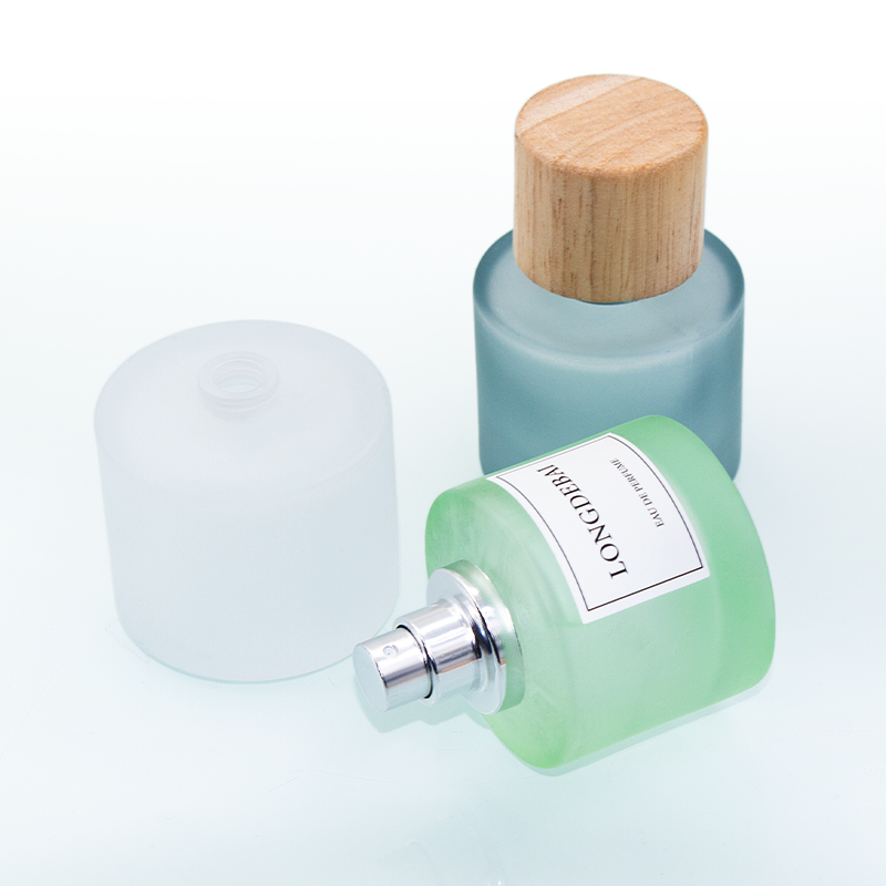 Wholesale empty frost green blue round 50ml glass perfume bottle with wooden lid