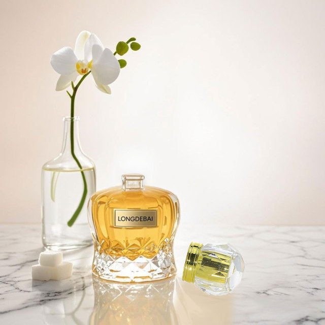 Luxury unique crown shape crimp glass perfume bottle 50ml 100ml with zamac acrylic cap