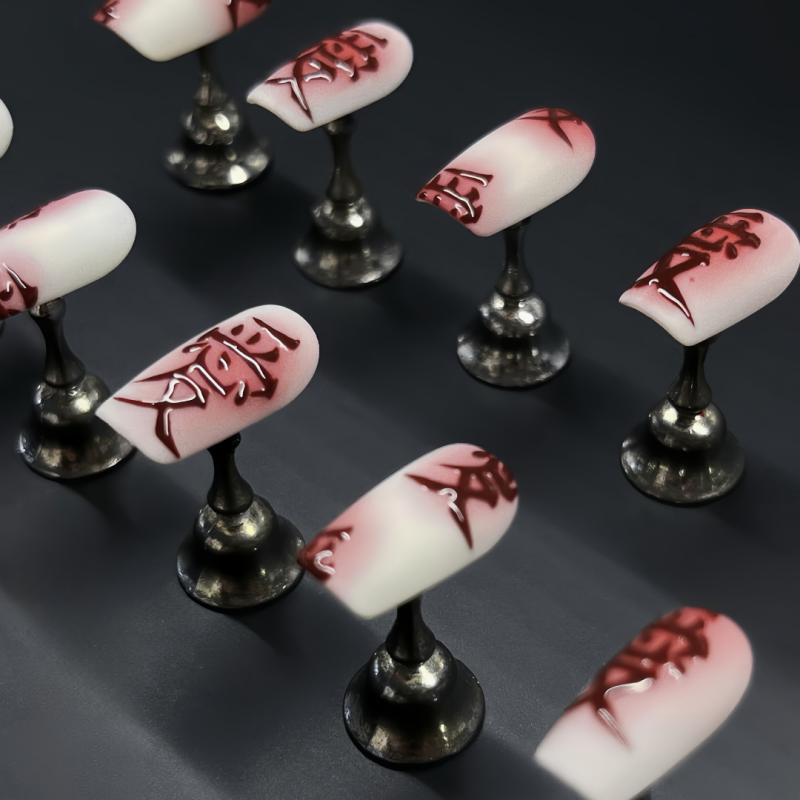 Close up of Love almond nail highlighting glossy finish and soft pink pigment
