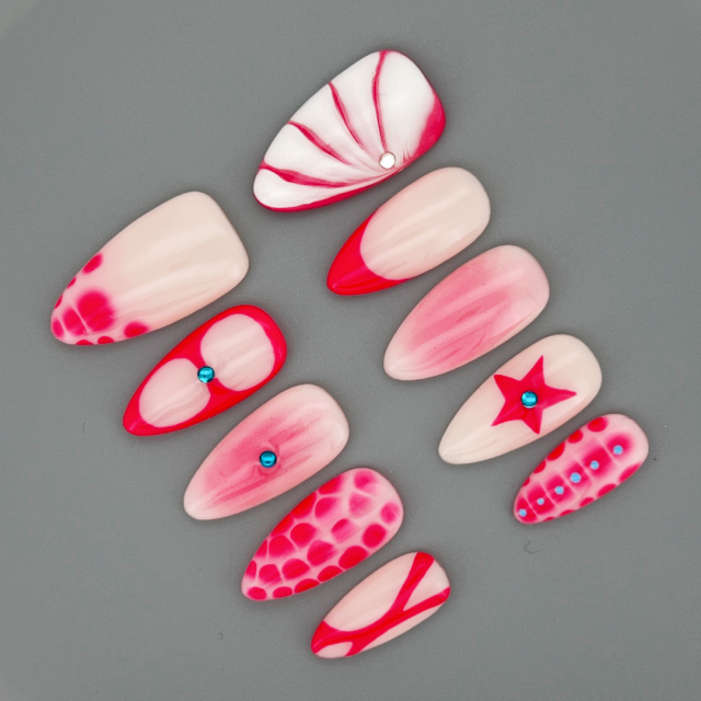 Close up of The Rosé Roar almond nail highlighting glossy finish and rich berry pigment