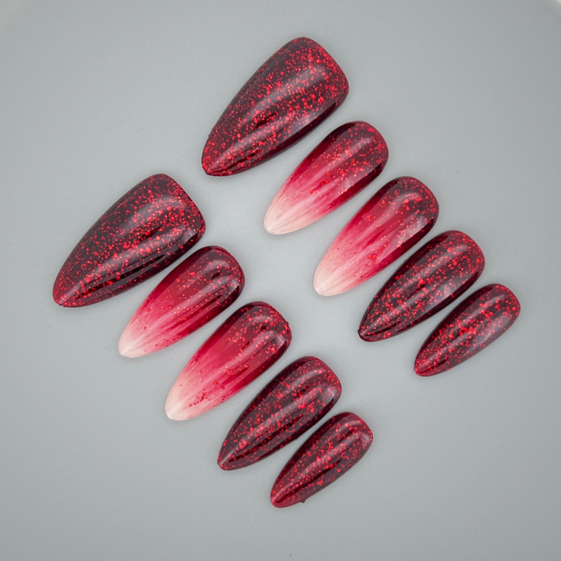 Close up of Fiesta Glam almond nail highlighting glossy finish and vibrant fuchsia pigment