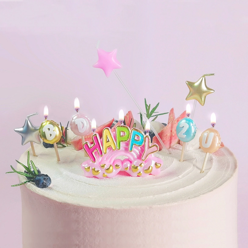 Rainbow birthday candle set styled on a celebration cake