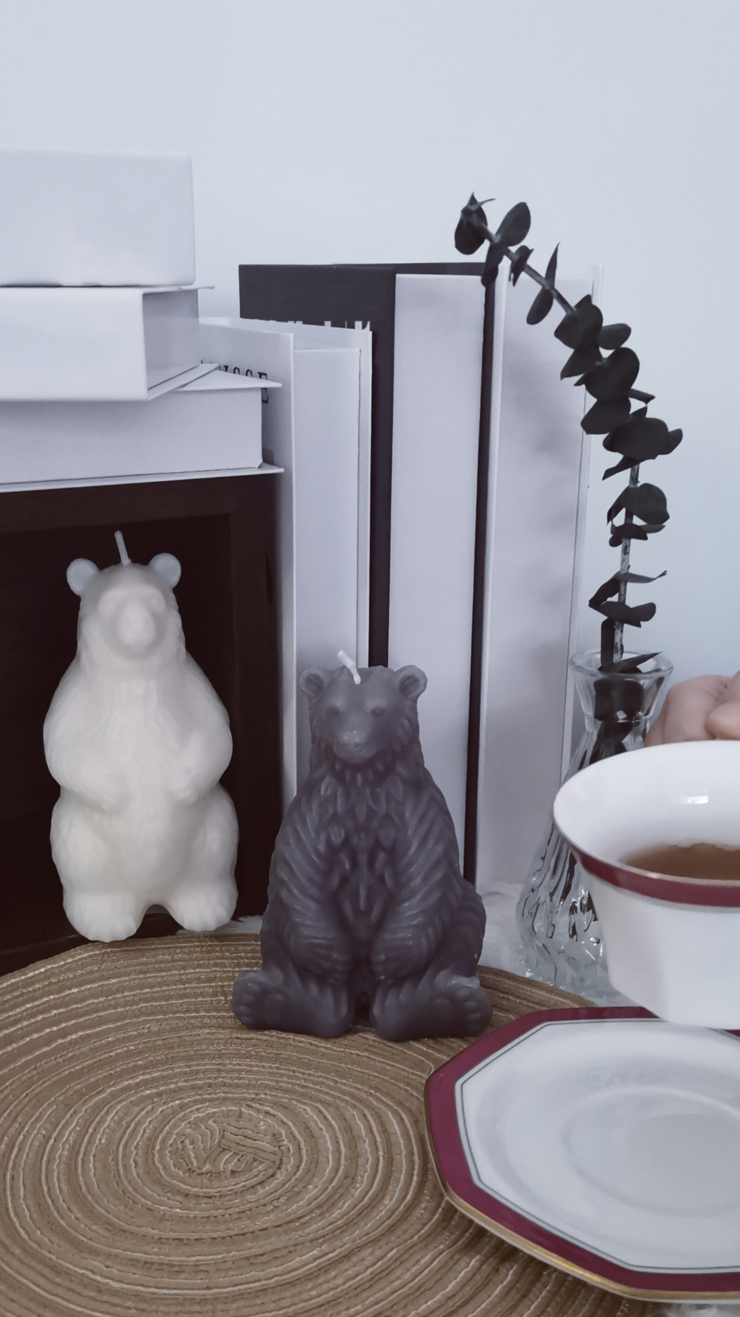 Polar Bears on a straw mat by a cup of coffee