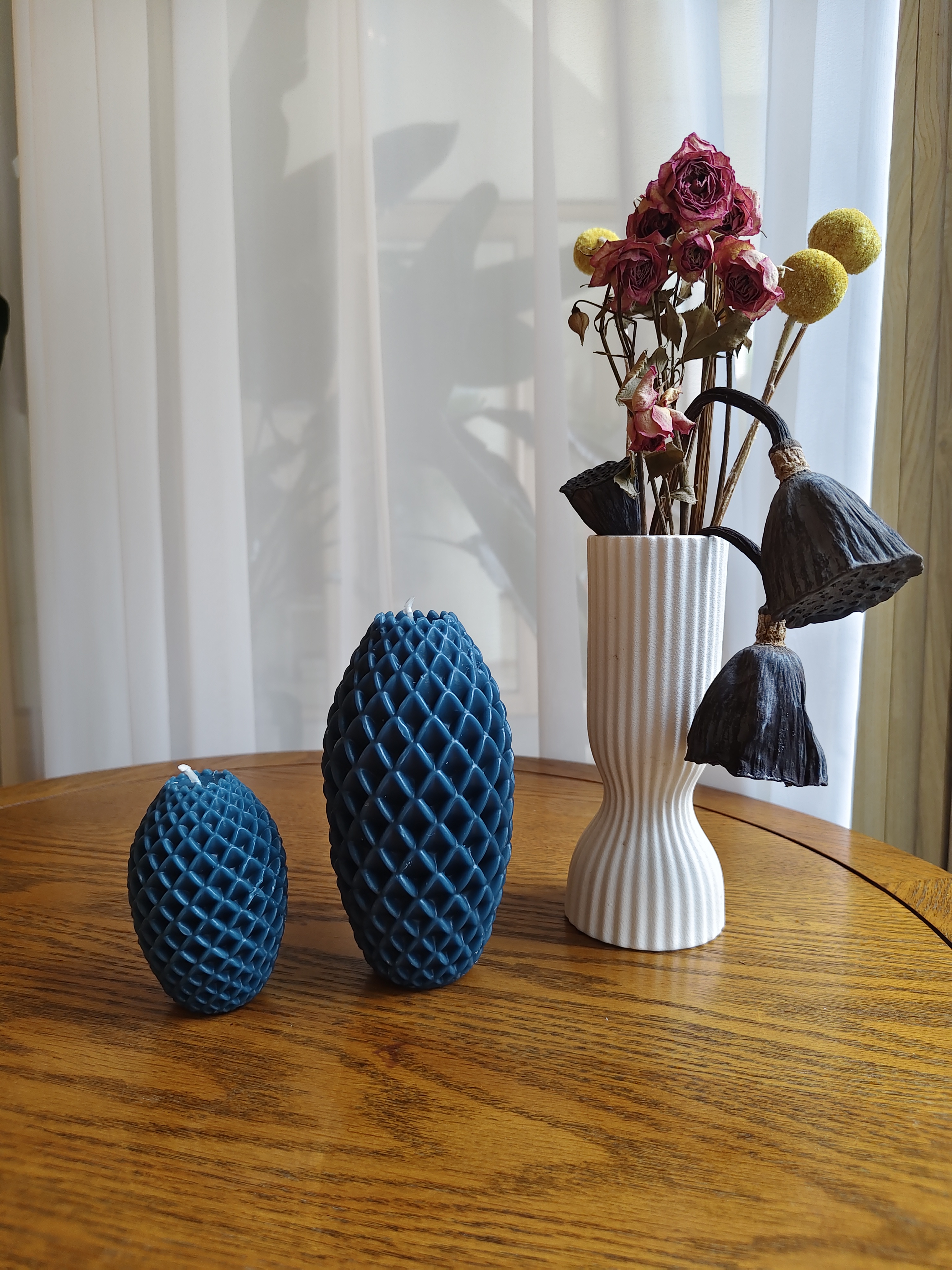 ocean blue pineapple candles on the table