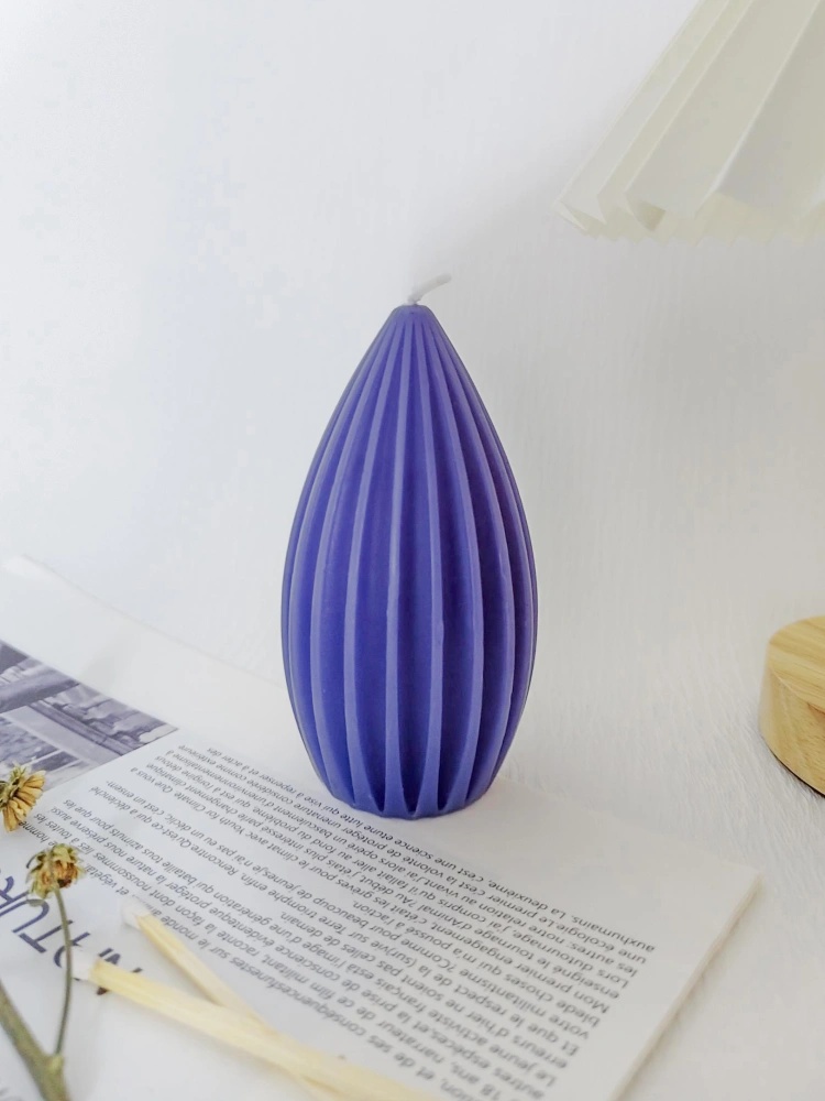Violet geometric candle acting as a colorful accent