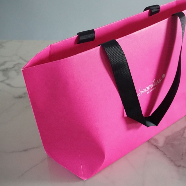 juyou paper Seamless fashion shopping bag custom printed Kraft bag grocery gift packaging pink paper bag with ribbed ribbon handle