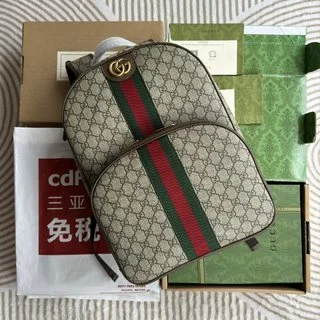 Supreme帆布書包 - 棕色皮革滾邊與紅綠條紋織帶的完美結合