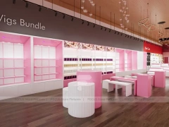 Pink Wig Boutique Wall Shelving with Central Demo Tables for Beauty Store