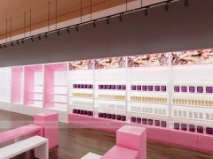 Pink Wig Boutique Wall Shelving with Central Demo Tables for Beauty Store