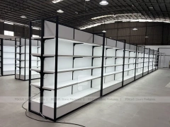 White Shelving Gondola Row with Black End Frames for Beauty Store