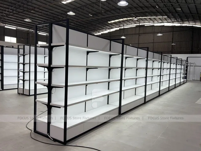 White Shelving Gondola Row with Black End Frames for Beauty Store