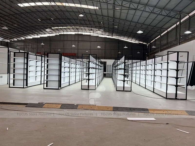 White Shelving Gondola Row with Black End Frames for Beauty Store