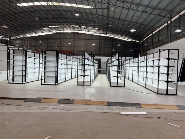 White Shelving Gondola Row with Black End Frames for Beauty Store