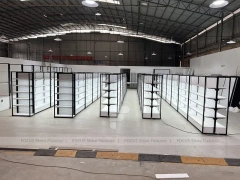 White Shelving Gondola Row with Black End Frames for Beauty Store