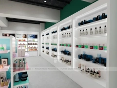 Wide Beauty Supply Retail Floor with White Island Shelving for Wig Shop