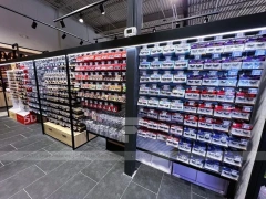 Black Beauty Supply Wall Shelving with Pink Category Bays for Wig Shop