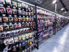 Black Beauty Supply Wall Shelving with Pink Category Bays for Wig Shop