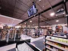 Black Framed Beauty Supply Store with Central Service Island for Wig Shop