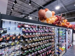 Black Framed Cosmetics Wall and Gondola Aisle Layout for Wig Shop
