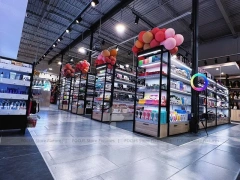 Long Dark Beauty Supply Wall Shelving Aisle for Wig Shop