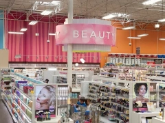 Open Beauty Supply Floor with White Shelving and Pink Sign for Wig Shop
