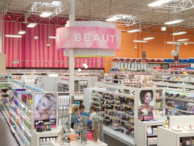 Open Beauty Supply Floor with White Shelving and Pink Sign for Wig Shop